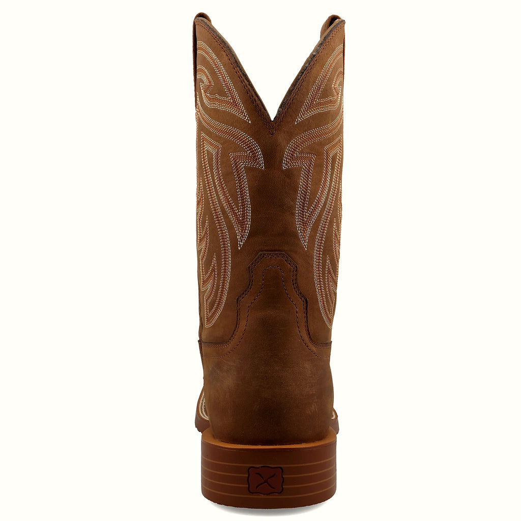 Boot with a walking heel and integrated spur shelf
