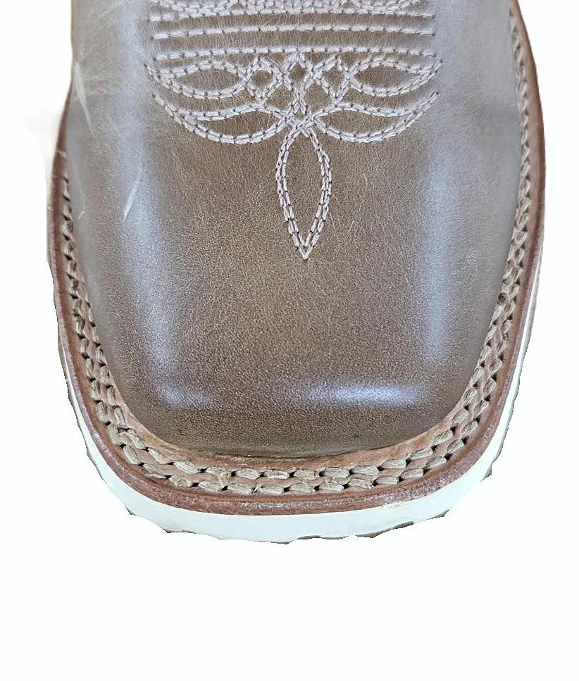 Western boot with a broad flat toe box